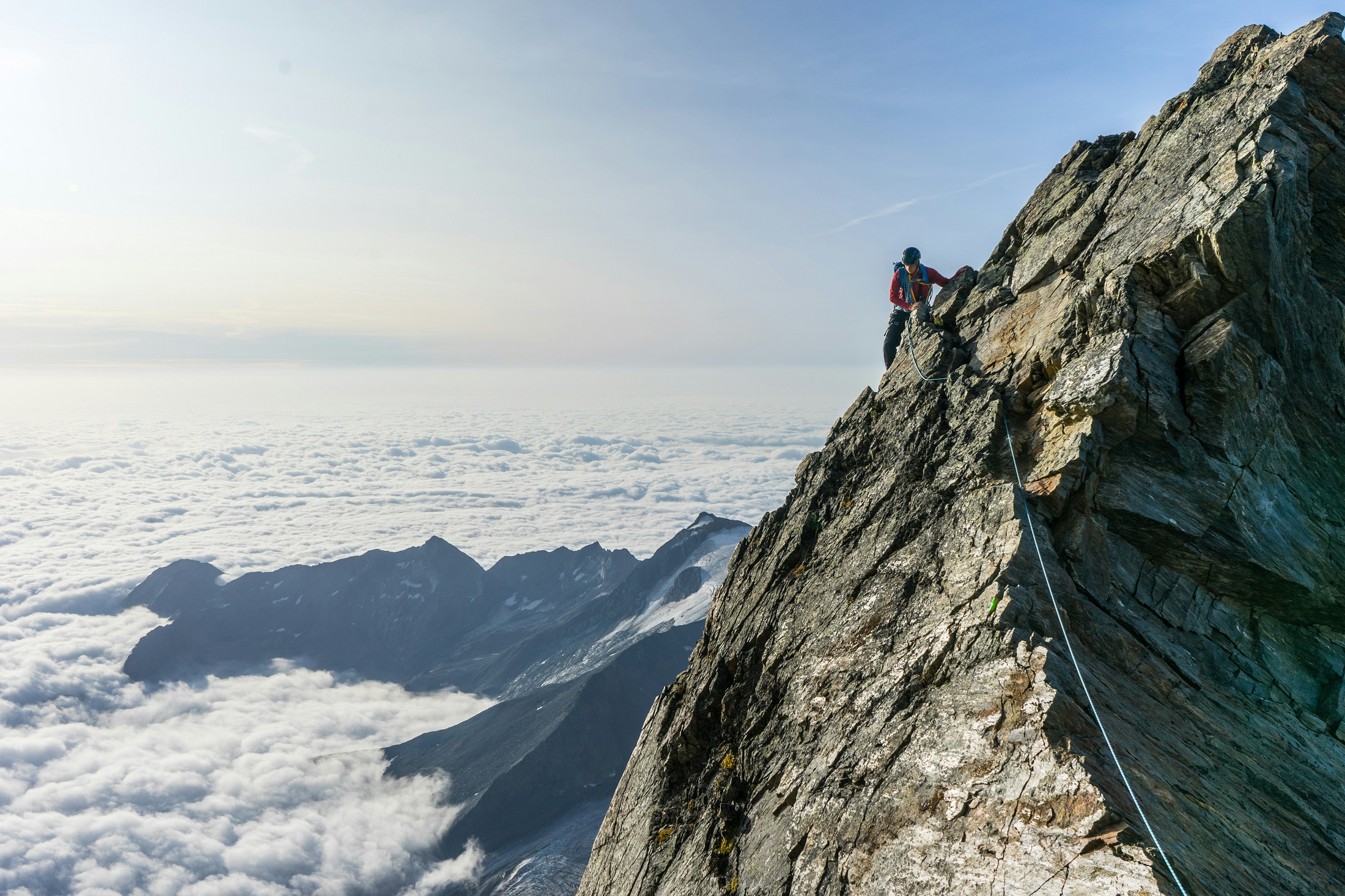 Climber representing a freelance content writer scaling a mountain for growth