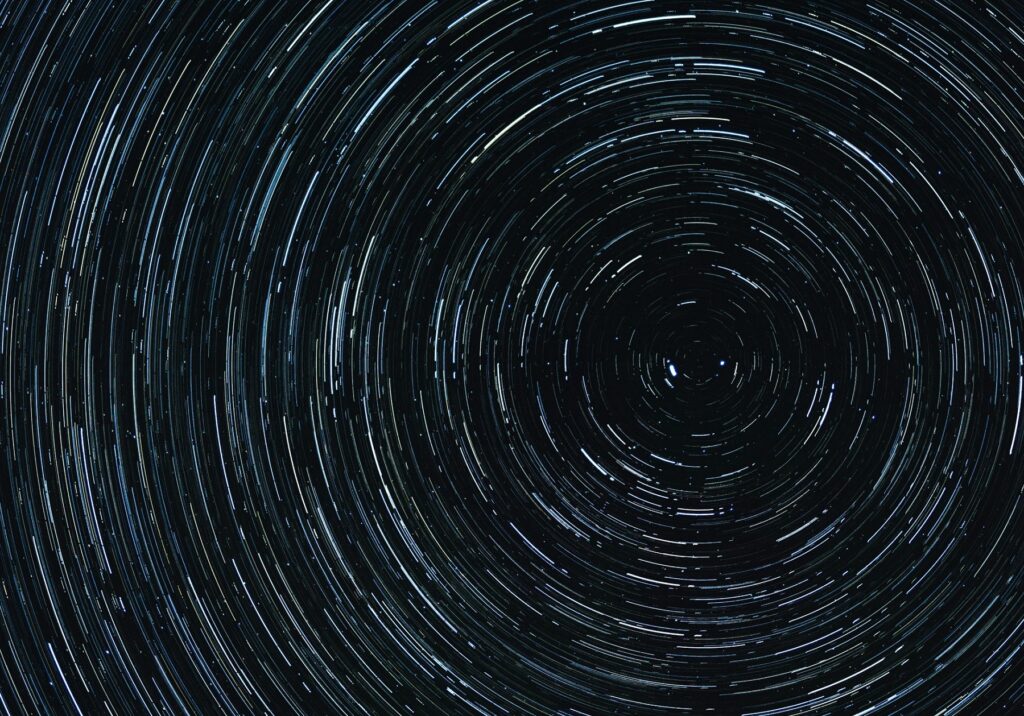 Space orbit art symbolizing the factors influencing AEO and AI search 