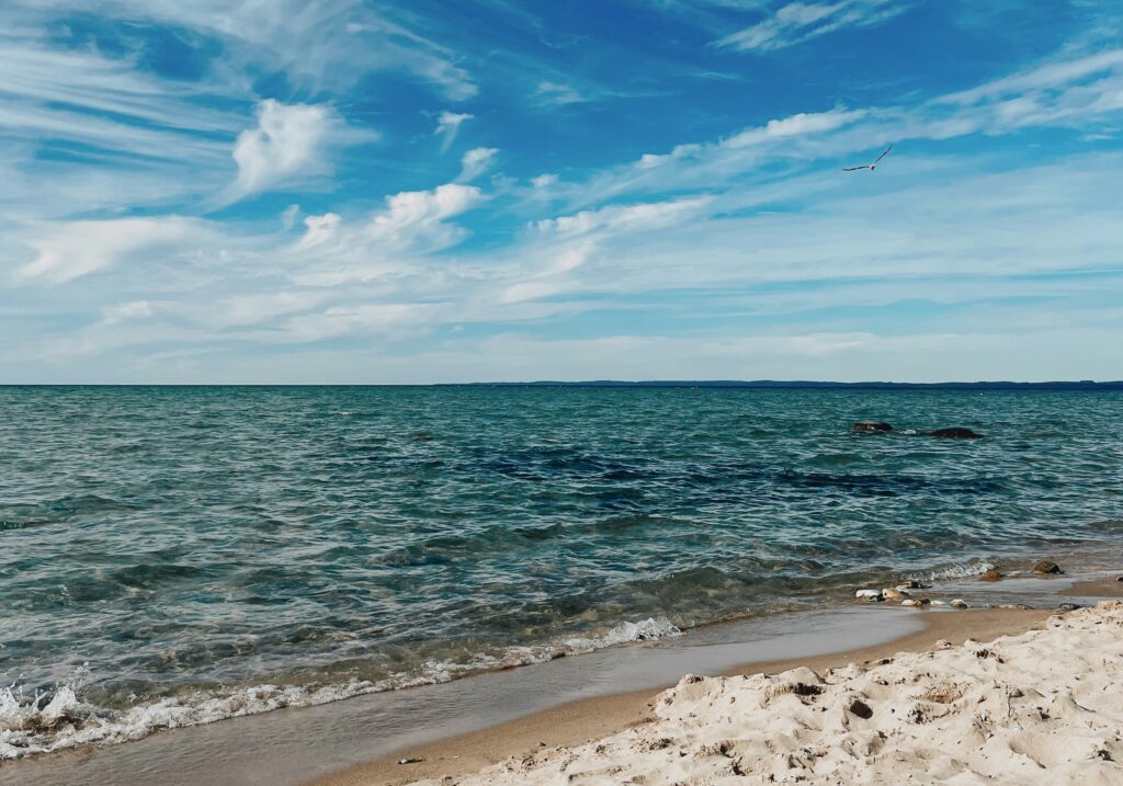 Best Thing to do in Traverse City, MI in the summer is go to the sandy freshwater beach