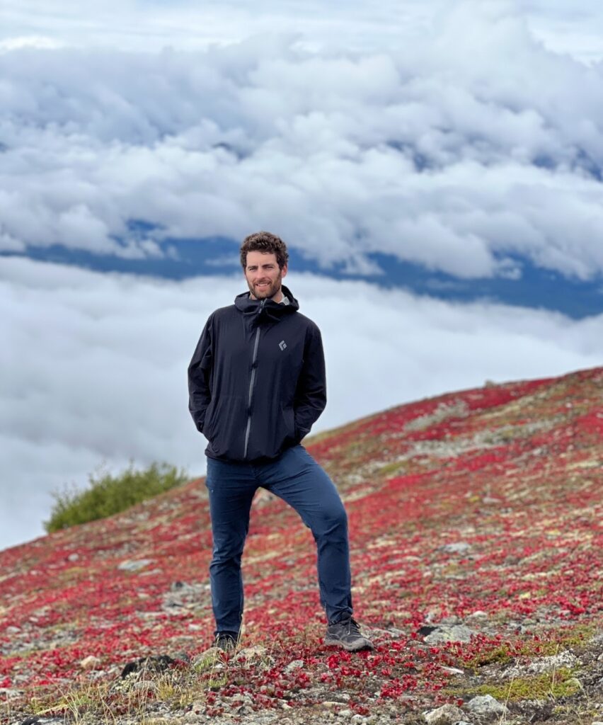 Tyler Tafelsky, freelance PPC consultant, standing on a mountain top in Alaska